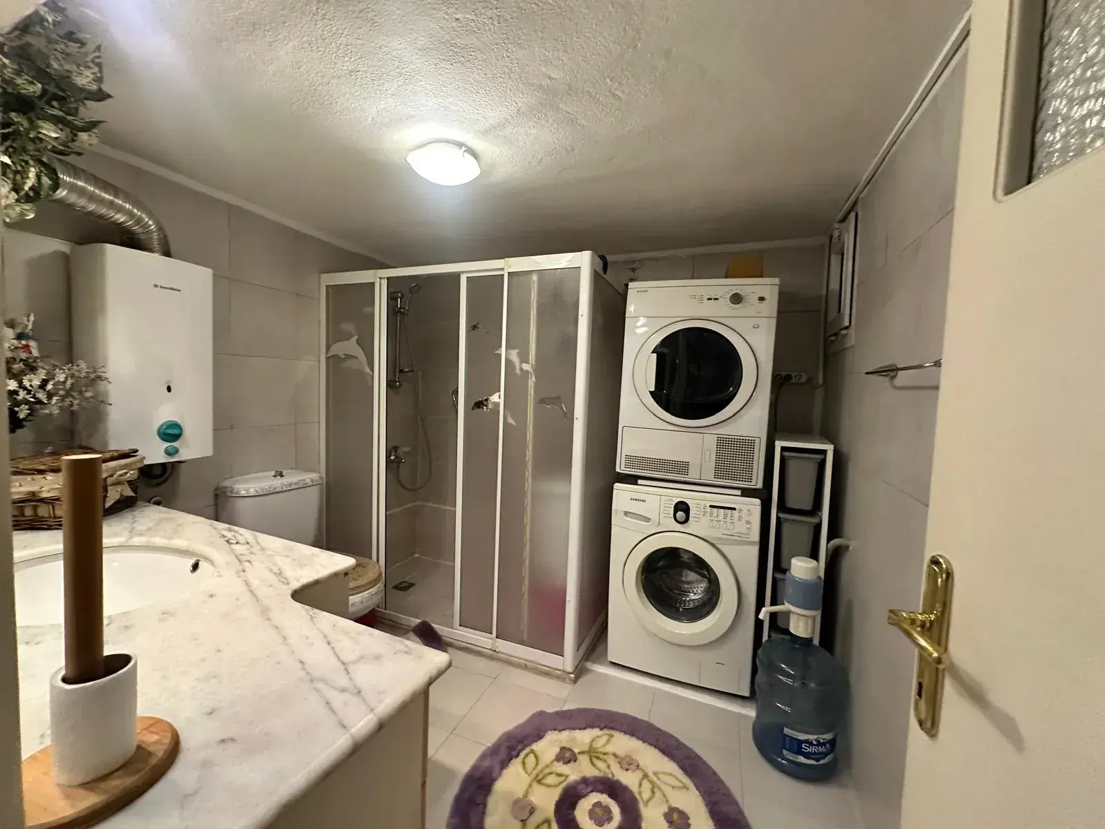 MERKEZDE TAHSİN BAYKAL CADDESİNDE SATILIK DAİRE